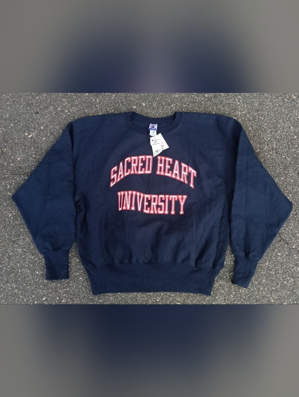 Champion Navy Crewneck with Red & White Sacred Heart University Logo